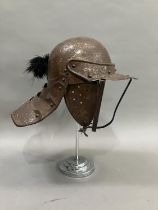 A reproduction steel English Civil War period style lobster-tailed pot helmet with three bar face