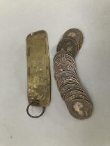 An Edwardian Imperial Hotel brass room key together with twenty 1919 pennies