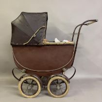 A circa-1940s toy pram by The Silver Cross with retractable hood, along with a number of small