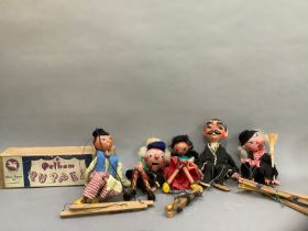 A Pelham Puppet 'Dutch Boy', in original box together four others, unboxed, including Mexican