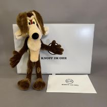 A Steiff mohair plush figure of Warner Bros Cartoon’s ‘Wile E. Coyote’, number 6 of 1500, 36cm high,