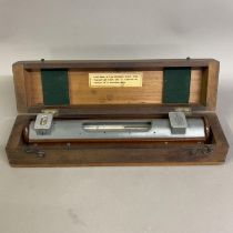 A master standard calibration level by Cooke, Troughton & Simms Ltd of York in fitted mahogany case