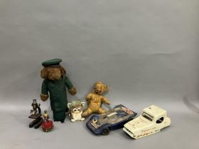 A 1950s Harrods Mouse door stop, a mid century jointed teddy bear, an original late 90s Furby, a