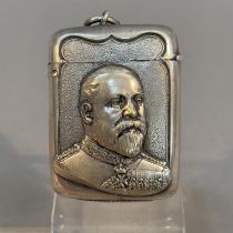 An Edward VII commemorative base metal vesta embossed with a head and shoulders portrait of