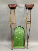 A pair of early 20th century wood and leather crutches by the Wantage Adjustable Crutch Company,