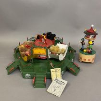 A Hermann Teddy musical carousel, numbered 12 of 500 with three teddy bears, along with a