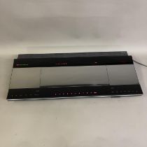 A 1986 Bang & Olufsen Beocenter 9300 CD/cassette music centre. Crack to front panel, but