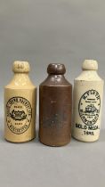 Three Victorian stoneware bottles variously labelled Hardy's Crown Brewery Ltd Manchester, H Firth