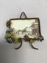 A Victorian cold painted gilt wire miniature photograph frame with hanging loop. 6.5cm x 7cm