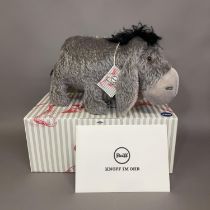 A Steiff mohair plush figure of ‘Eeyore’ from Disney’s cartoon Winnie the Pooh, number 777 of