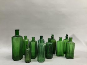 A collection of eleven green glass poison bottles (two with stoppers), 12.5cm to 22.5cm high