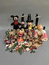 A collection of Walt Disney toys, including a Selco Mickey Mouse, a Burbank Toys pull string