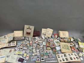 A large quantity of cigarette and trade cards in albums and loose (1000+)