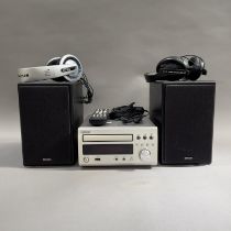 A Denon CD Receiver, model RCD-M37DAB, a pair of Denon SC-M37 loudspeakers and two pairs of