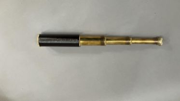 A three draw brass and leather wrapped telescope