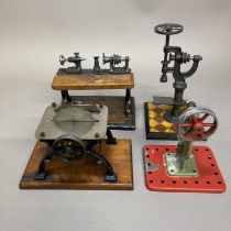 Four belt driven accessories for miniature steam engines, including a lathe, a pillar drill, a