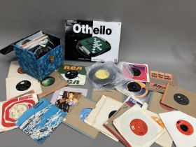 A collection of 7” singles from the 60s and 70s, including Another Day by Paul McCartney, Keep On