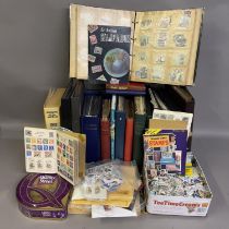 A large collection of stamps and philatelic ephemera consisting of a good number of albums, tins