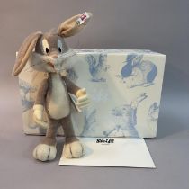 A Steiff mohair plush figure of Warner Bros Cartoon’s ‘Bugs Bunny’, number 927 of 2000, 26cm high,