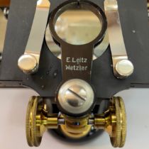 A boxed Leitz Wetzlar inspection scope, with assorted magnification eyepieces, a boxed brass