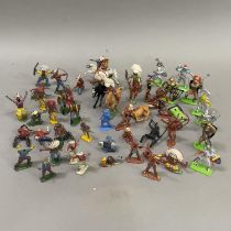 A collection from Britains, Timpo, Herald and others of mainly lead and some plastic toy cowboys,