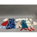 A quantity of doll's clothes, babies bonnets and bootees