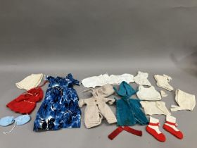 A quantity of doll's clothes, babies bonnets and bootees