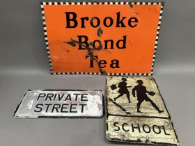 A Brooke Bond Tea enamel sign in orange, black and white, 76cm x 51cm together with a white enamel