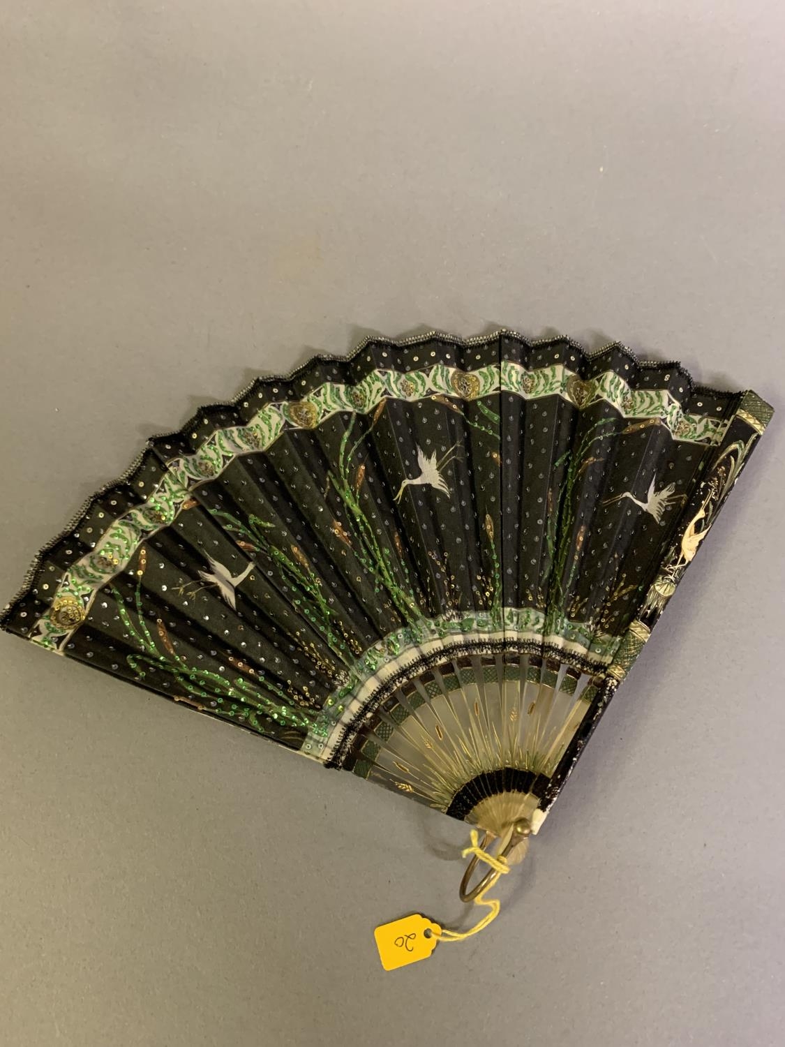 An Art Nouveau fan, the monture of bone, shaped and gilded, the silk leaf painted with a lady in a - Bild 7 aus 10