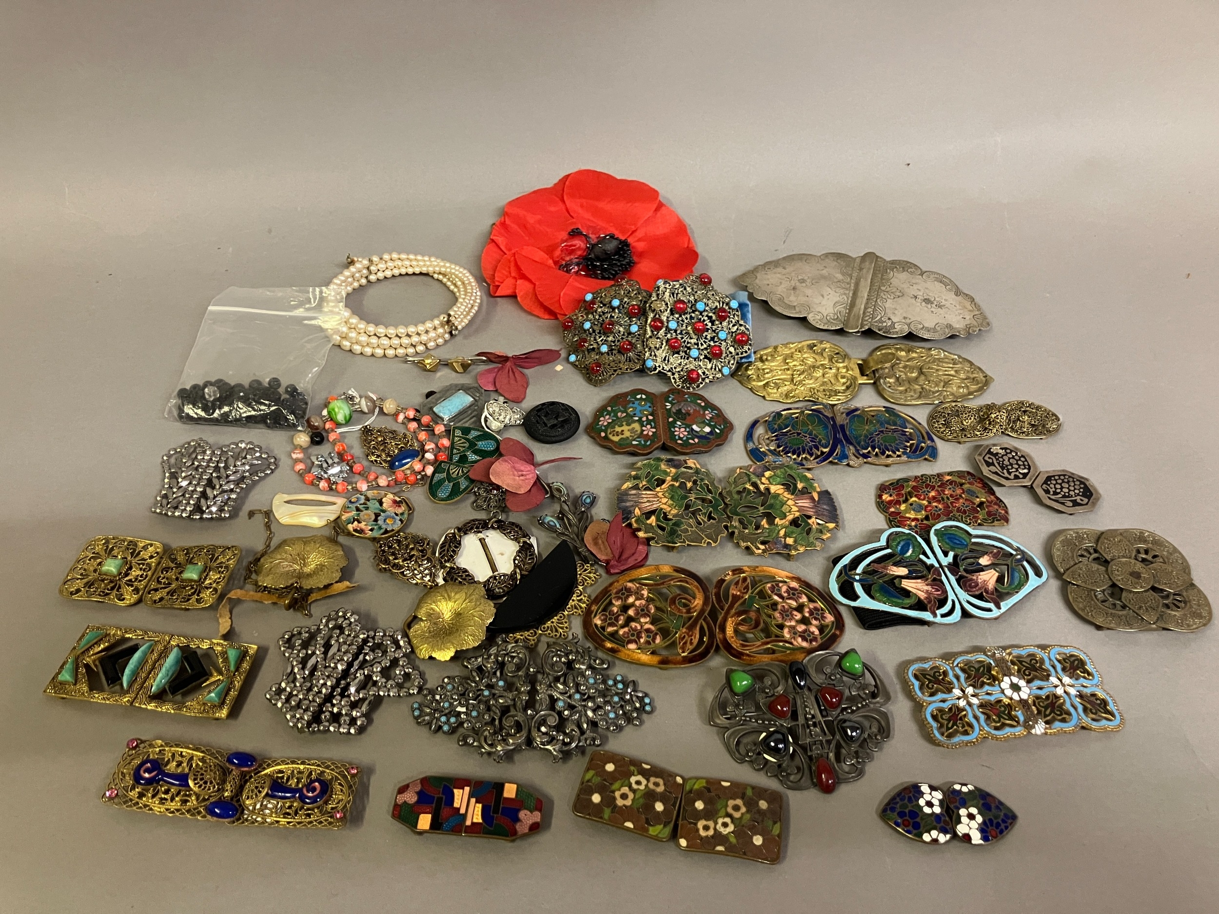 A good selection of 19th and 20th century buckles in metal, others in enamel, others in heavy base