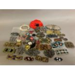 A good selection of 19th and 20th century buckles in metal, others in enamel, others in heavy base