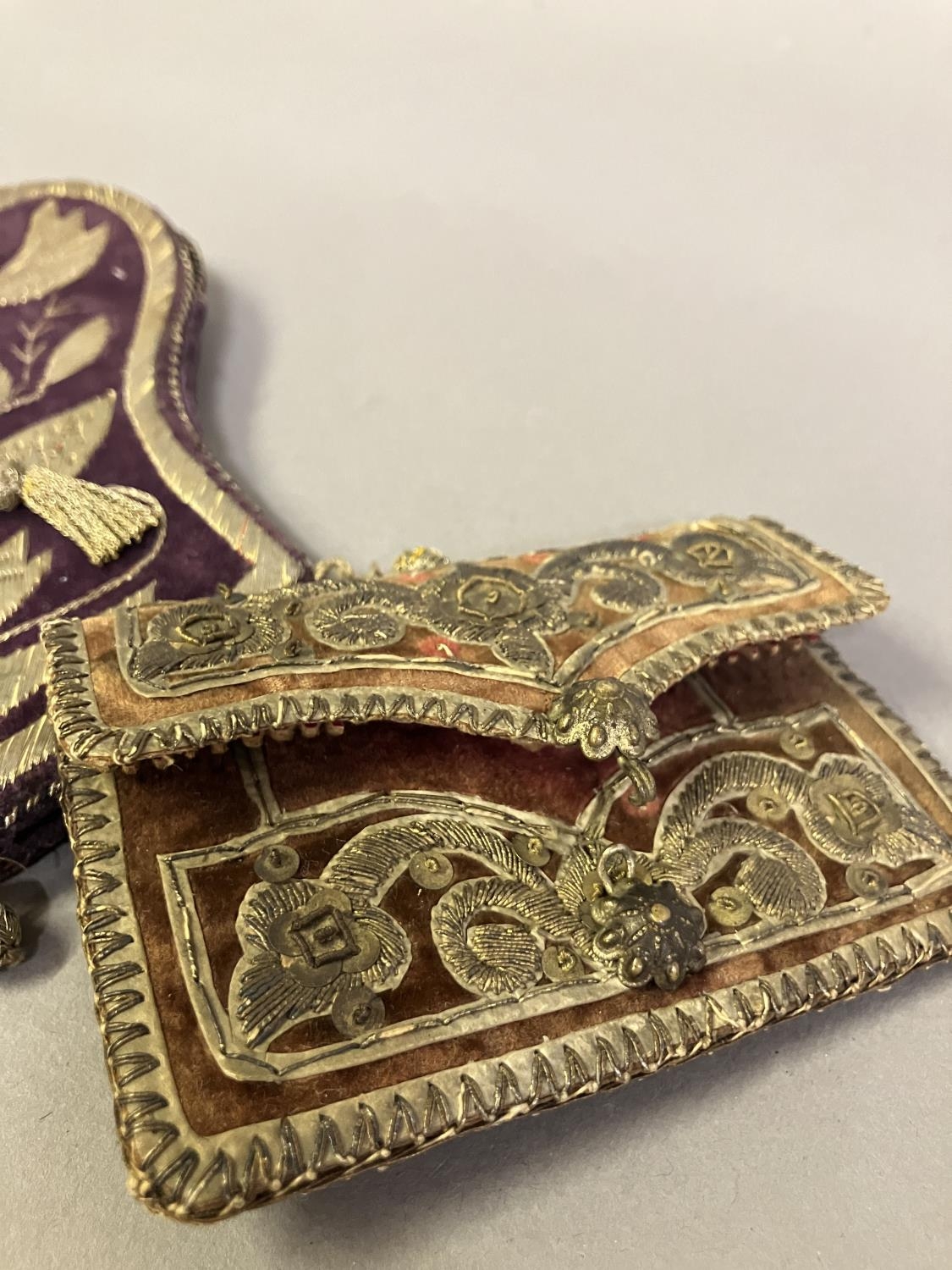 Antique Ottoman purses, two in plum velvet, one in ruby leather, all embroidered in gold: the - Image 2 of 5