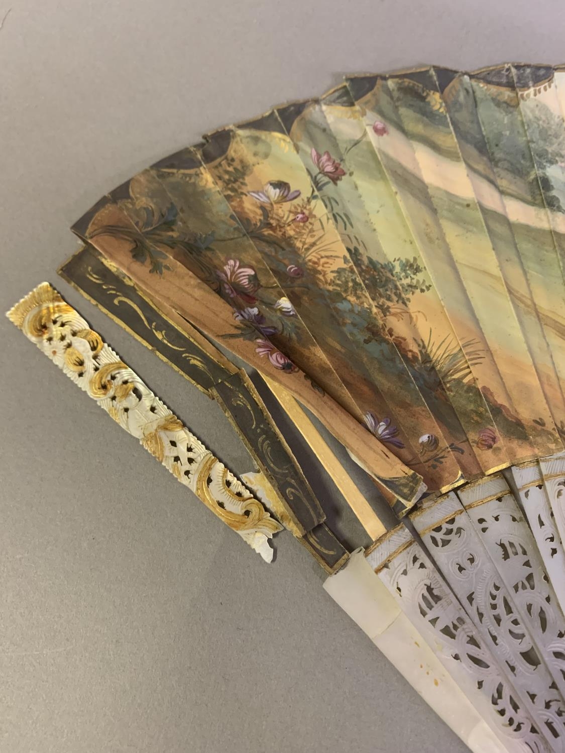 An 18th century mother of pearl fan with leaf of painted silk, showing a man seated on a throne, a - Image 4 of 9