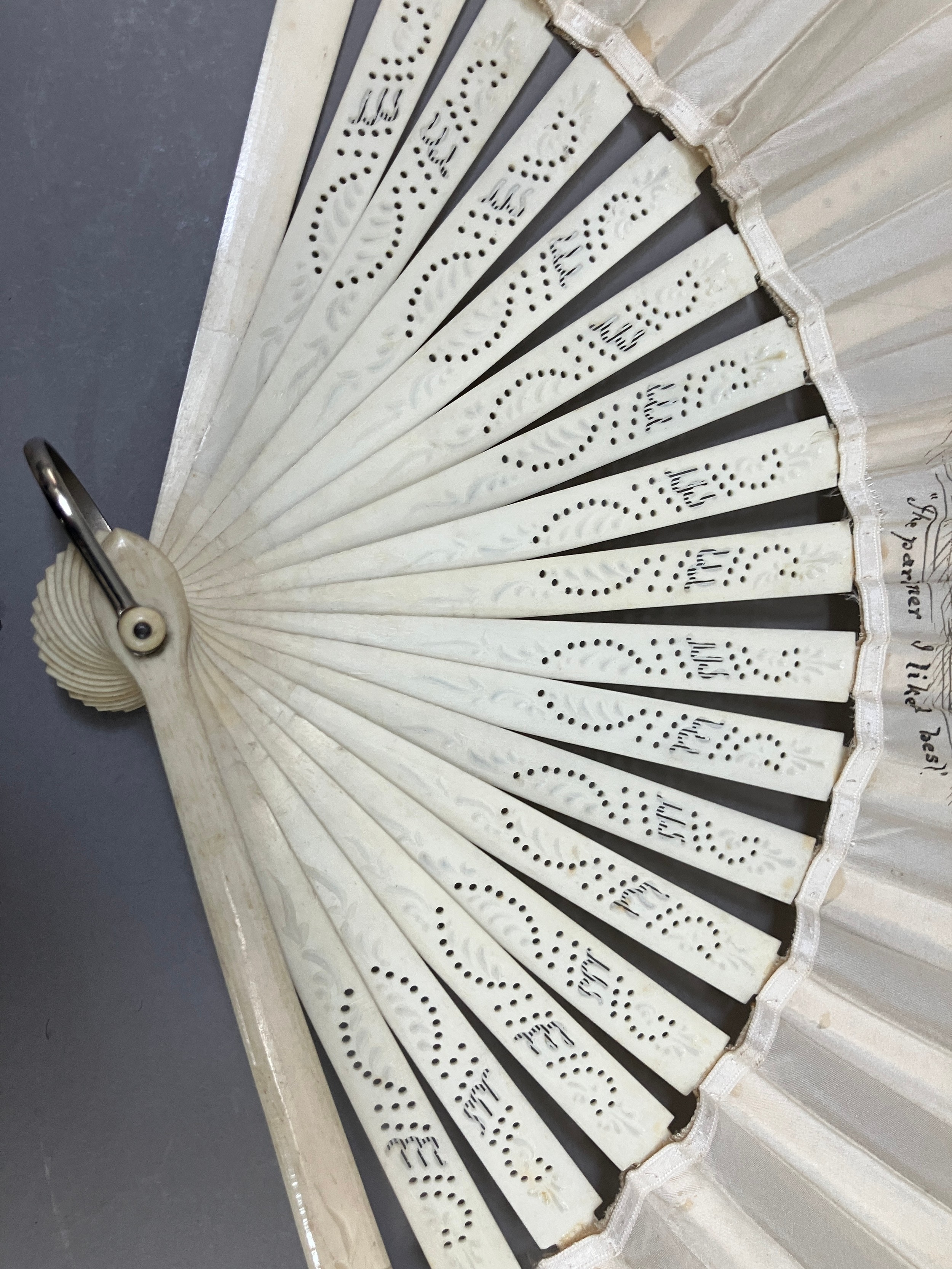 C 1890’s, an unusual incised bone fan mounted with a leaf of cream silk, bordered with a floral - Image 4 of 9