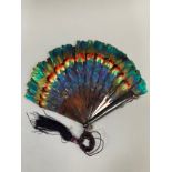 A small and attractive marquetry feather fan, the monture of faux tortoiseshell, the bands of