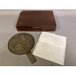 A Japanese Meiji period gilt bronze hand mirror, kagami, the recto with a design of fans, and