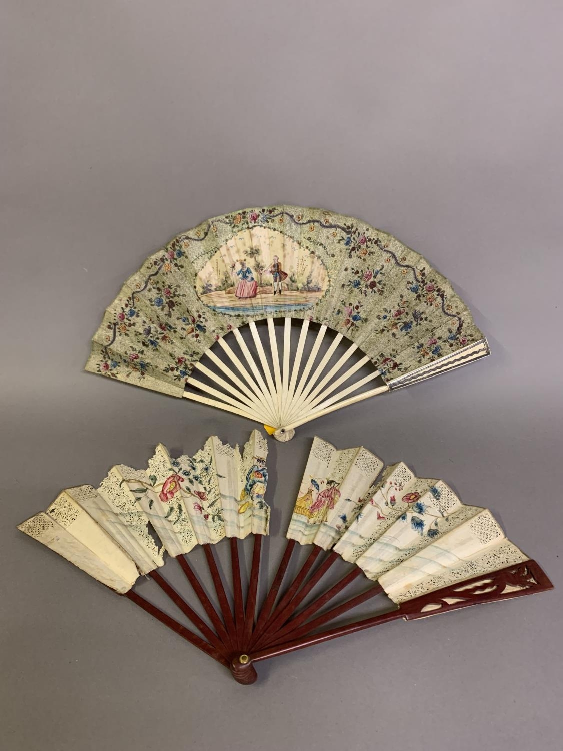 The 18th century: a very classical folding fan, the double paper leaf with central cartouche showing