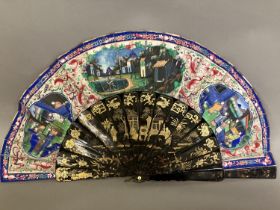 A mid-19th century Chinese Mandarin fan, the monture of wood lacquered in black and gilded, the