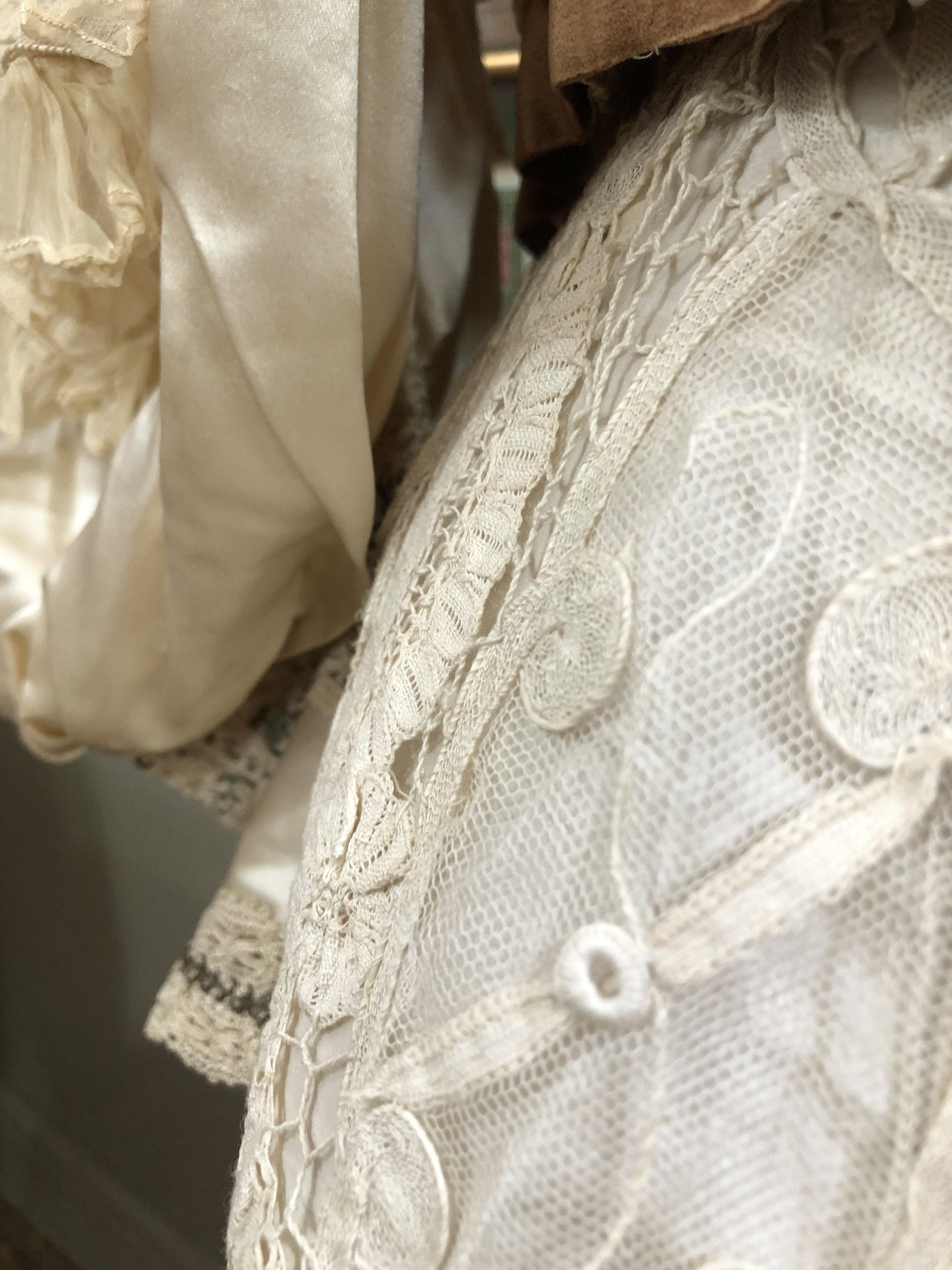 An Edwardian tapelace wedding ensemble, the high-necked bodice in ivory silk satin, trimmed with - Image 12 of 14