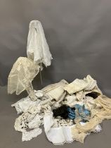 Antique lace: a bonnet veil in cream embroidered net, foliate design; two other hat veils in net,