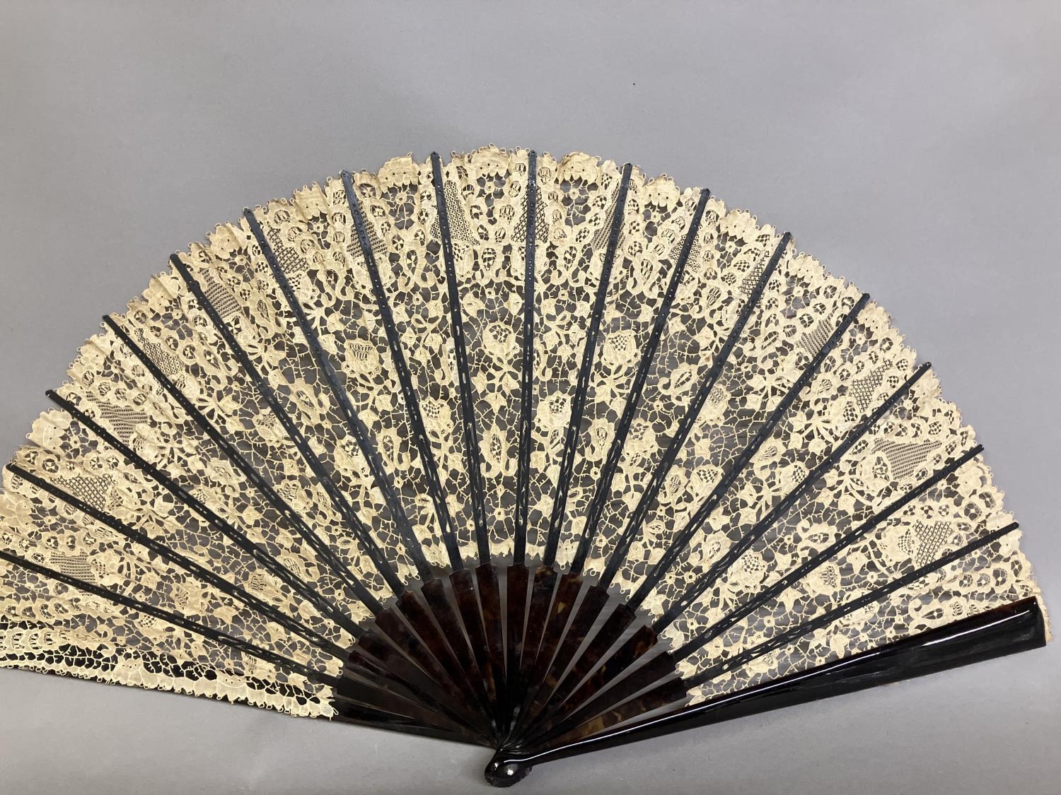 A large late 19th century Carrickmacross lace fan, worked with more detail towards the upper edge, - Image 6 of 7