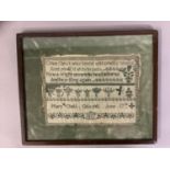 A small early 19th century needlework sampler, worked in dark green thread on fine linen, dated