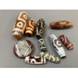 Trade beads: A selection from Tibet and elsewhere, dZi and others, in various sizes and with varying