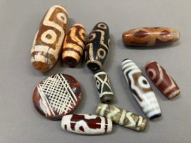 Trade beads: A selection from Tibet and elsewhere, dZi and others, in various sizes and with varying