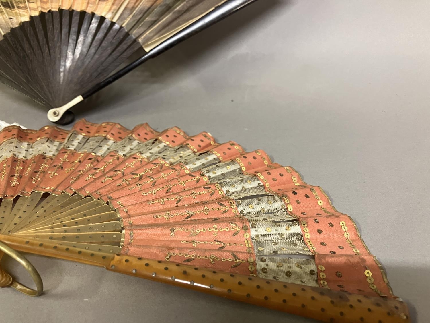 A Regency engraved and coloured fan with double paper leaf, and slender wood monture with bone thumb - Image 2 of 3