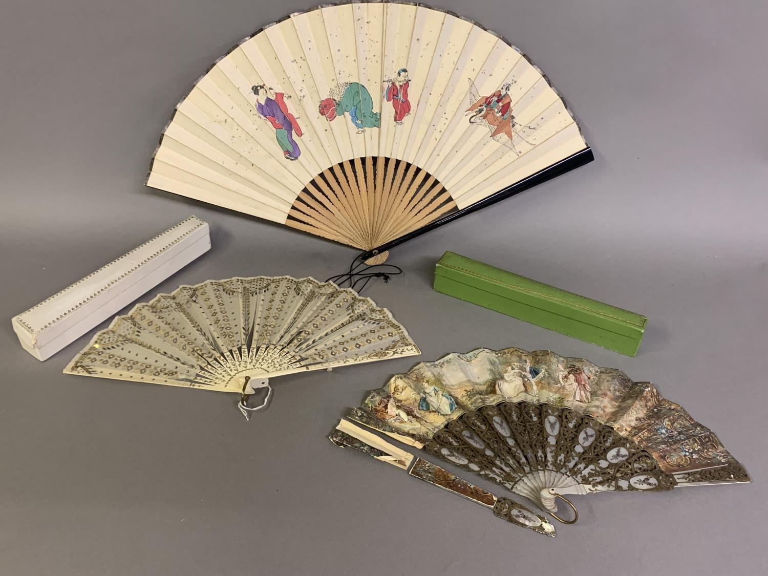 Three 20th century fans: the first, in white mother of pearl, a pastiche of an 18th century fan, the