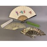 Three 20th century fans: the first, in white mother of pearl, a pastiche of an 18th century fan, the