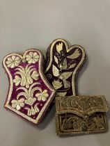 Antique Ottoman purses, two in plum velvet, one in ruby leather, all embroidered in gold: the
