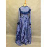 C 1865, a striped blue silk two-piece ensemble, short bodice with rear detail, trimmed with