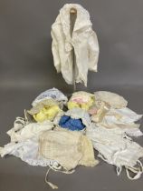 A selection of antique baby bonnets, from plain with front frill to more elaborate with detail to